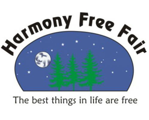 Logo for the Harmony Free Fair, featuring a night sky with a moon, stars, and three pine trees, with the slogan below.