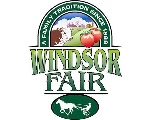 Logo for Windsor Fair featuring a cow, two apples, and a horse-drawn cart with the text 'A Family Tradition Since 1888.'