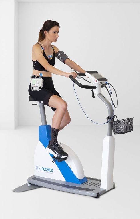 Woman riding a medical bike with Quark CPET Machine