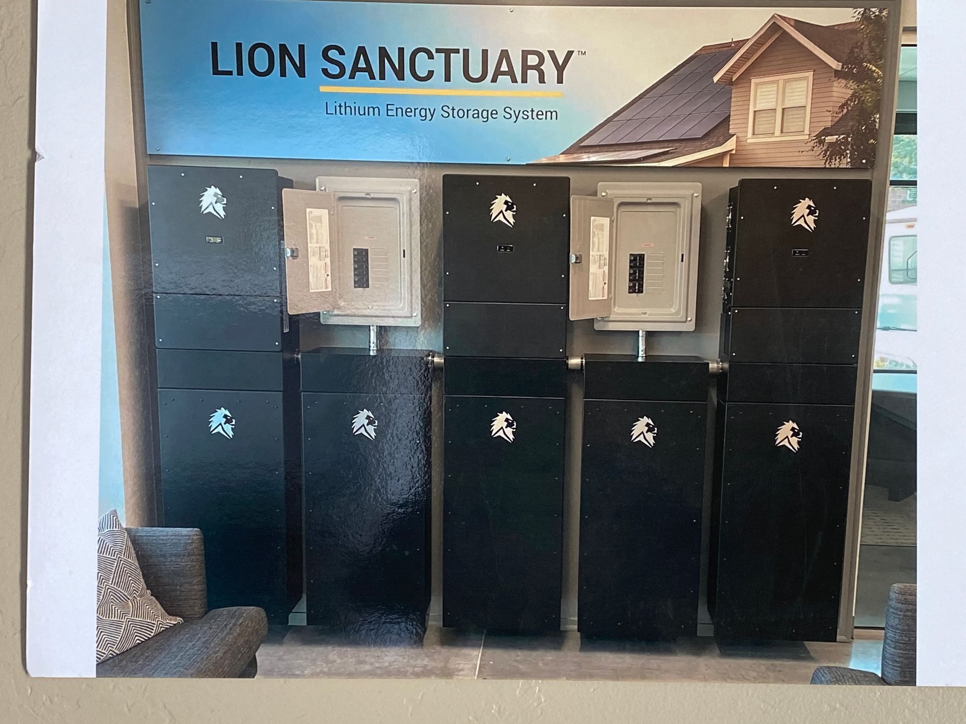 Lion Sanctuary sign above a row of black and silver animal kennels or lockers.