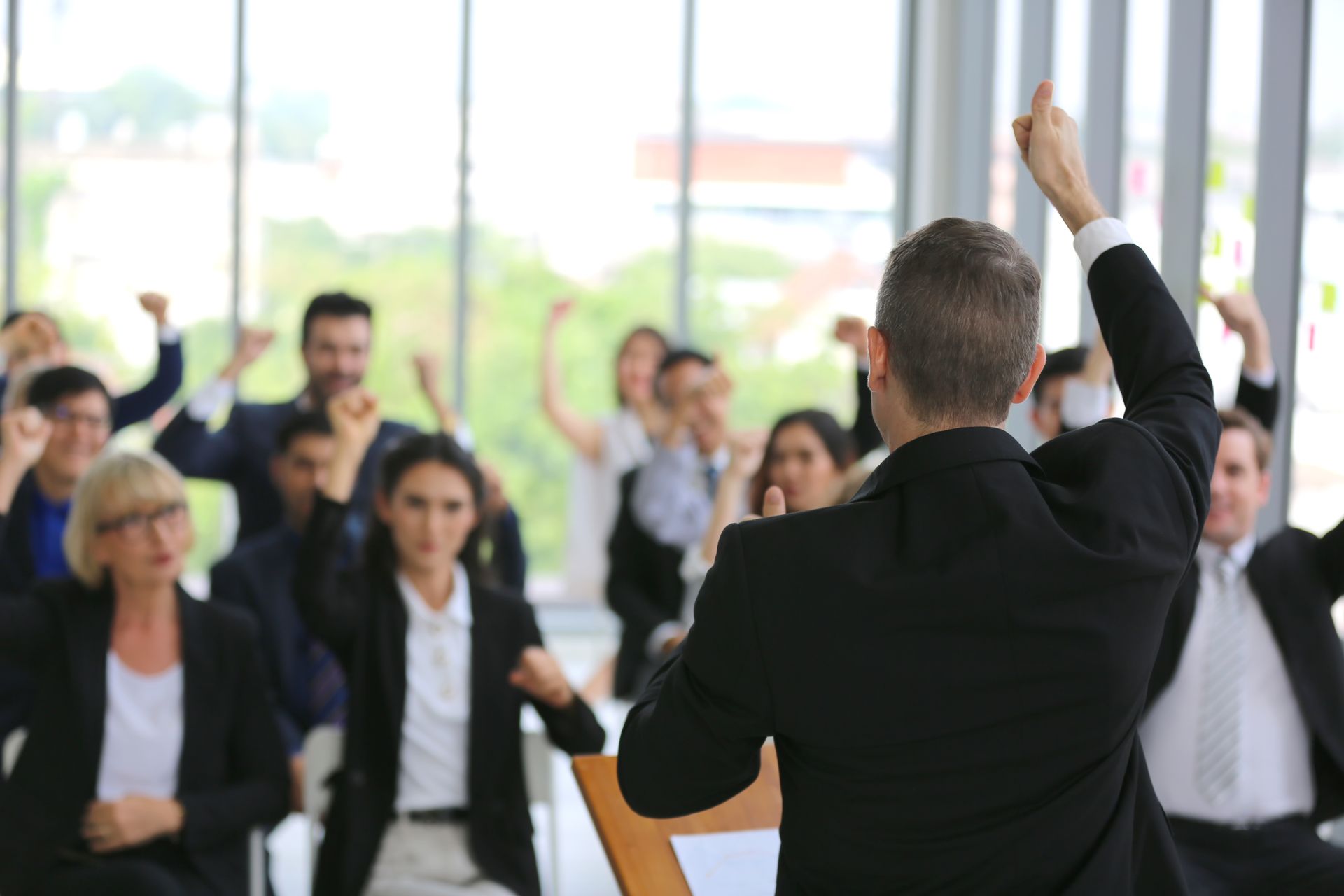 Diverse group of business professionals attentively engaged in a leadership seminar