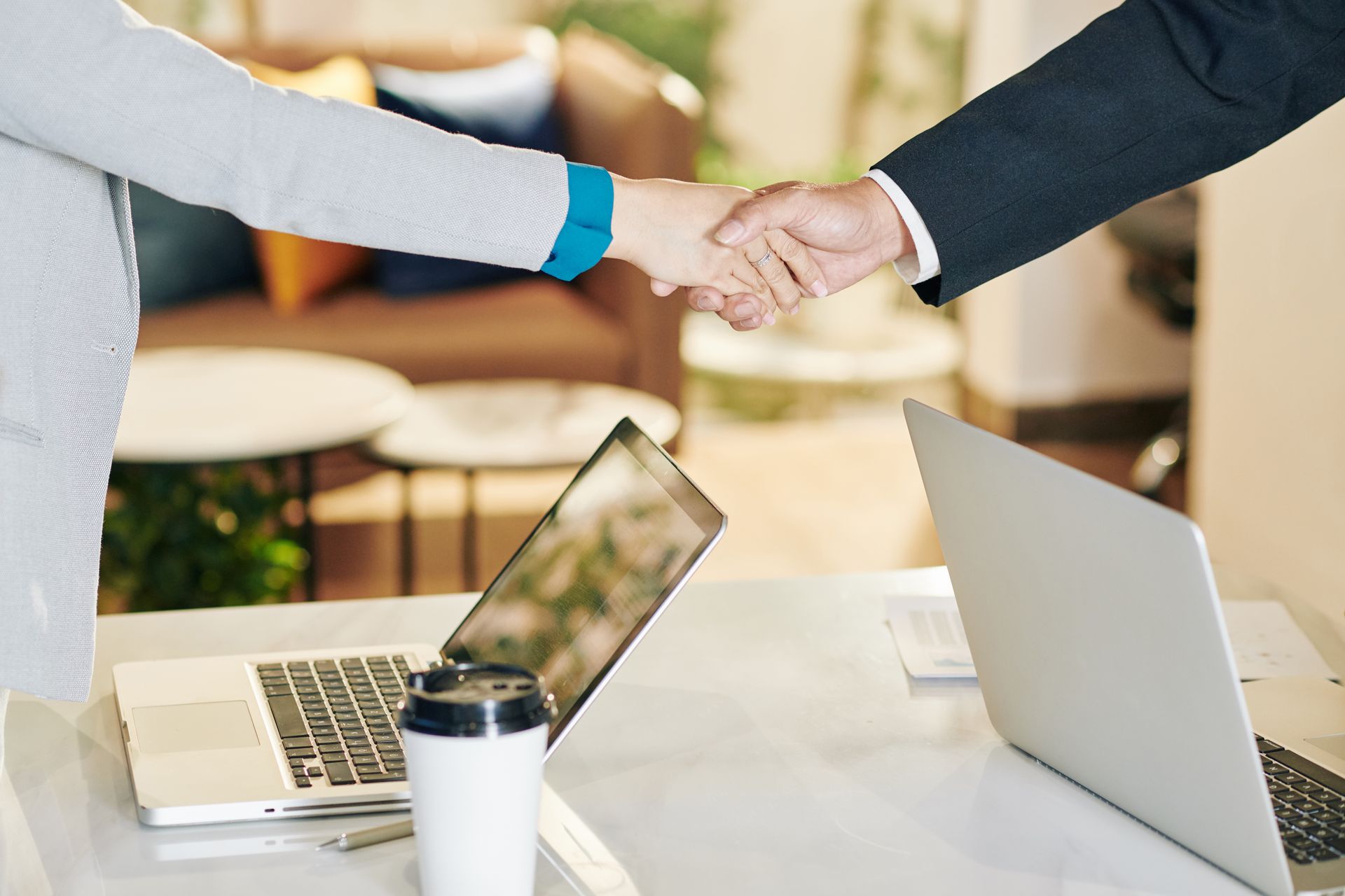 Business partnership handshake — career ownership coaching