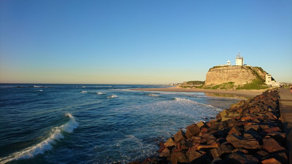 Lighthouse and Breakwater Enhance Coastal Charm — Custom Cabinetry in Newcastle, NSW