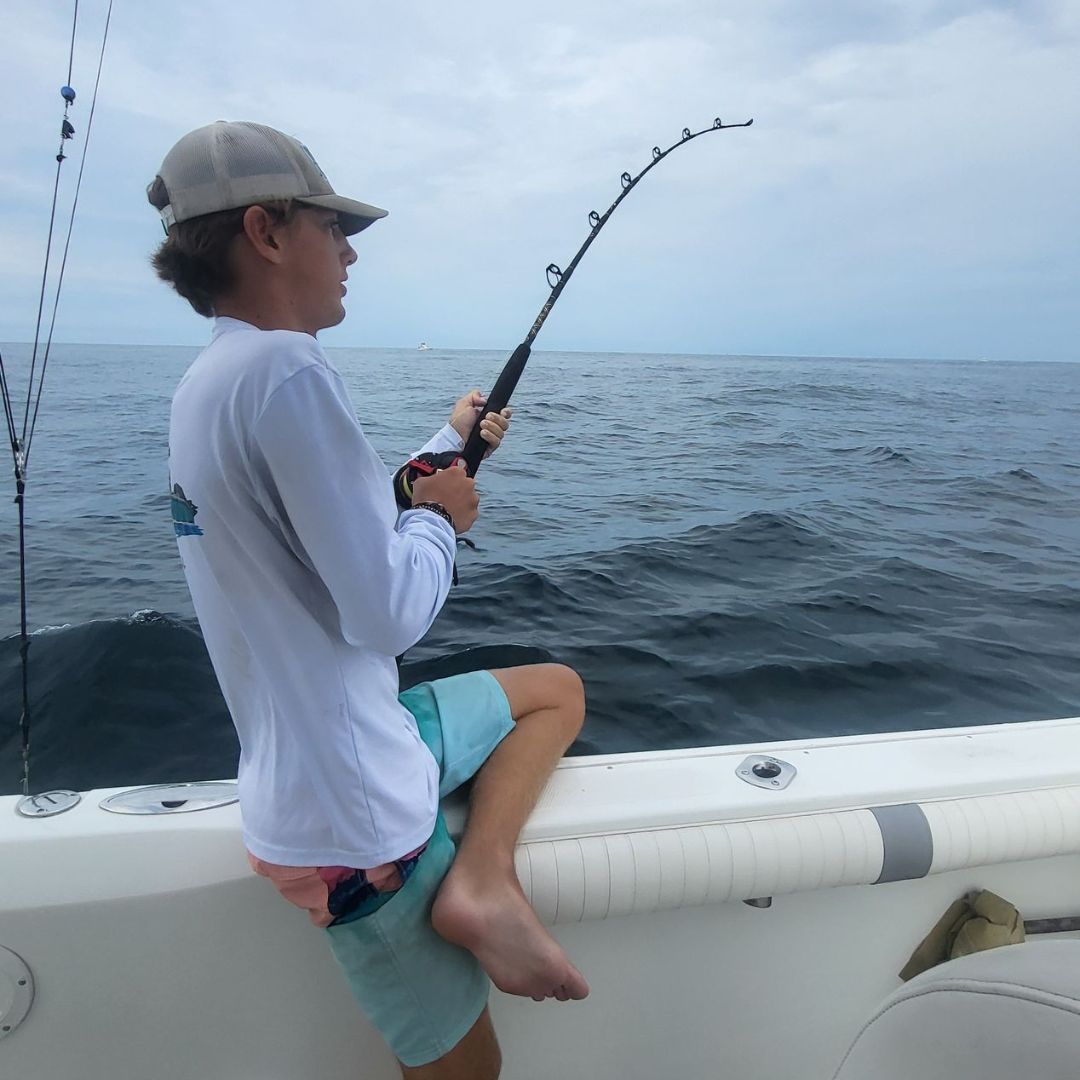 First Mate Ethan reeling in and checking the lines