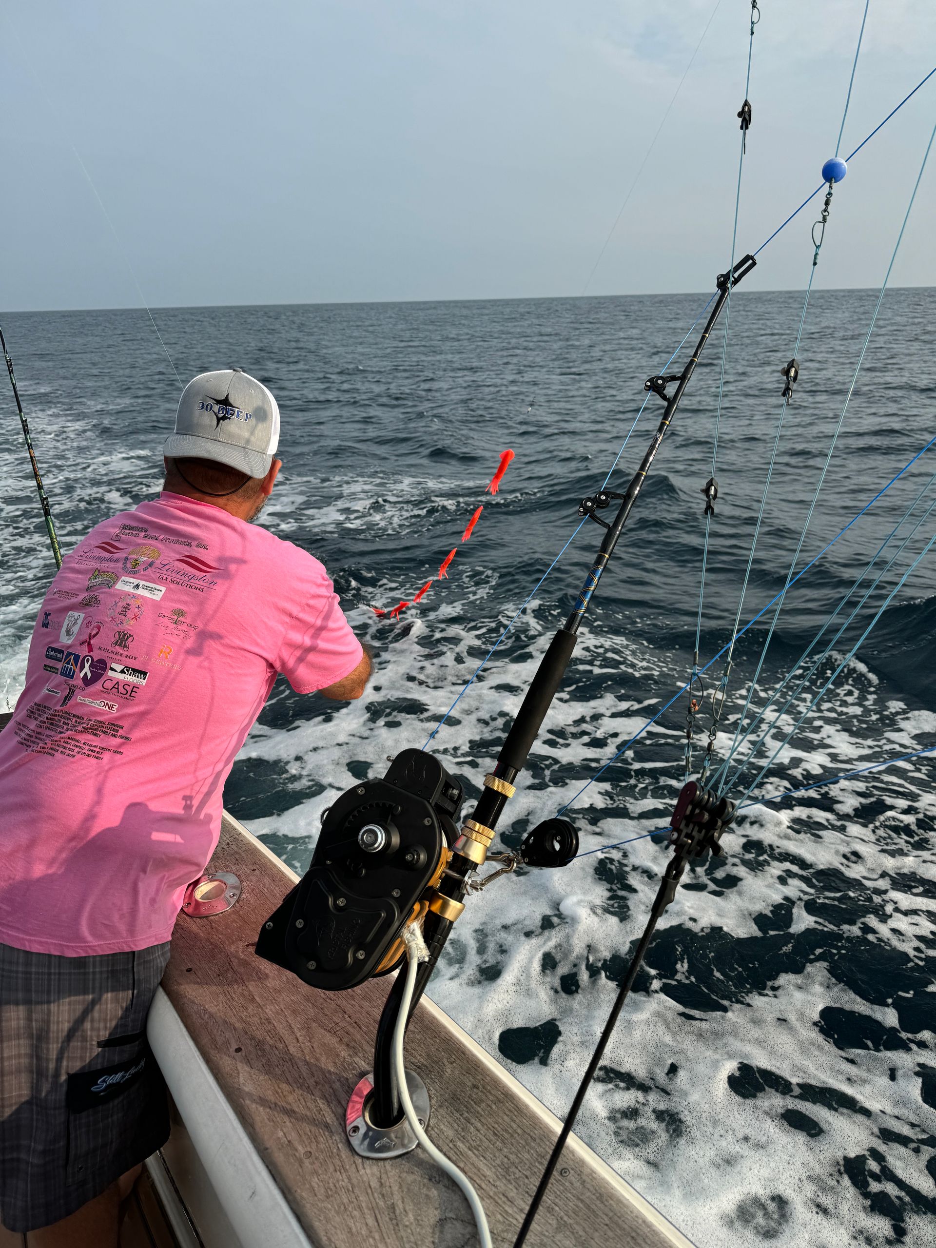 Captain Michael changing over the baits and adjusting the lures and dredges
