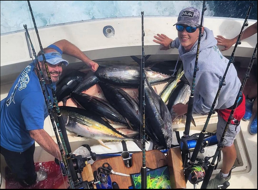 Captain Michael and Mate Ethan showing all of the yellowfin and bluefin tuna they caught