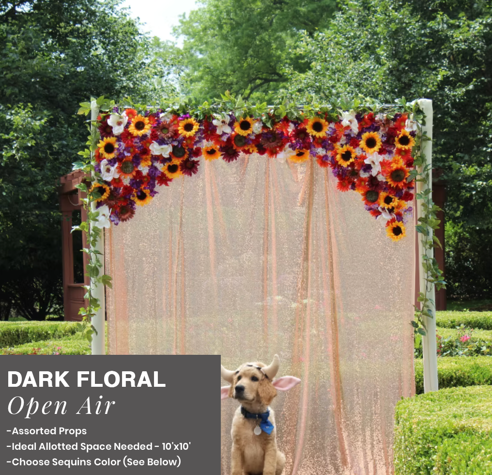 Dark floral open-air canopy with sheer drapes, adorned with orange and purple flowers, in a garden setting