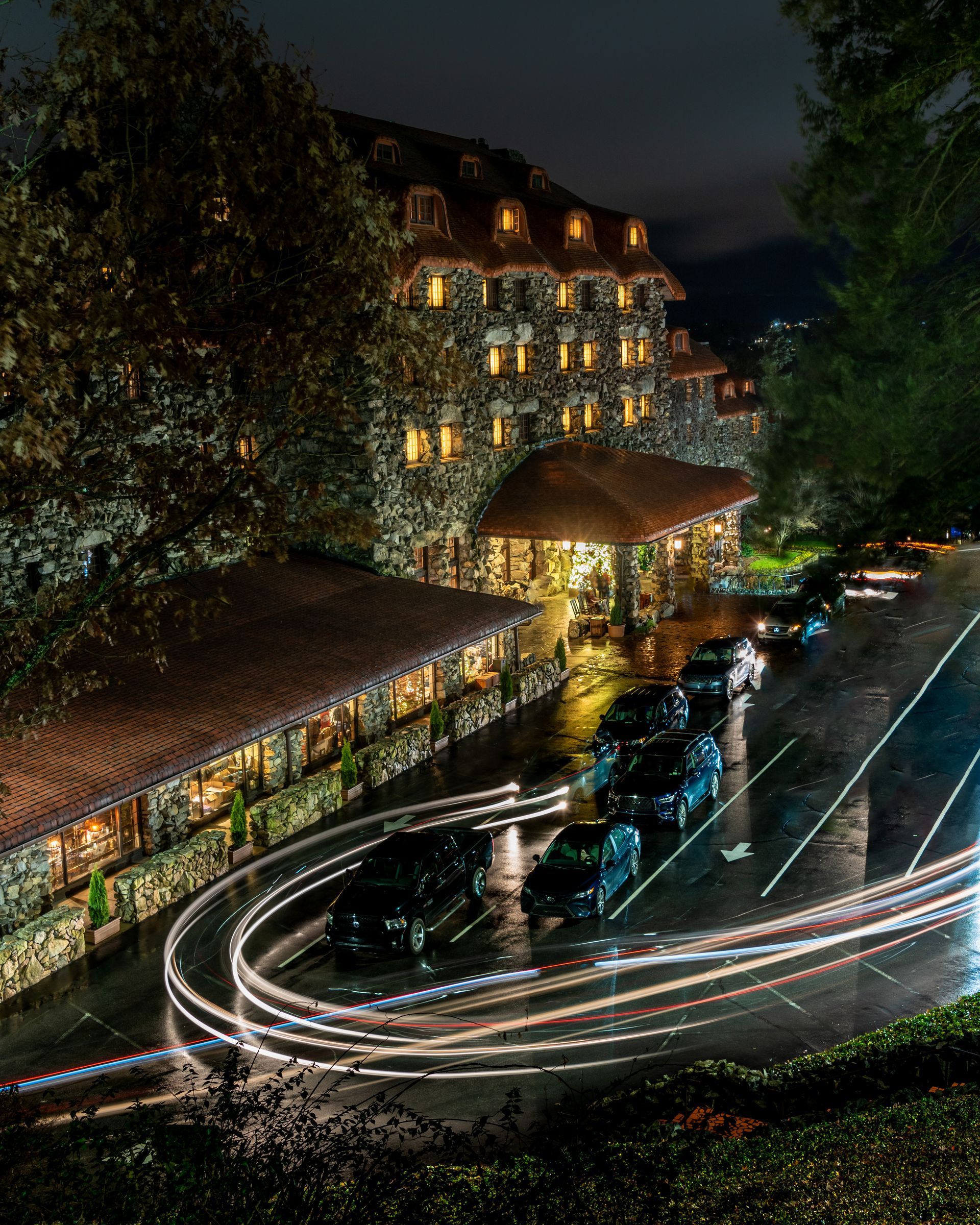 a row of cars are parked in front of a the Historic Grove Park Inn. Brad Burgess Photography, Talking Excitingly