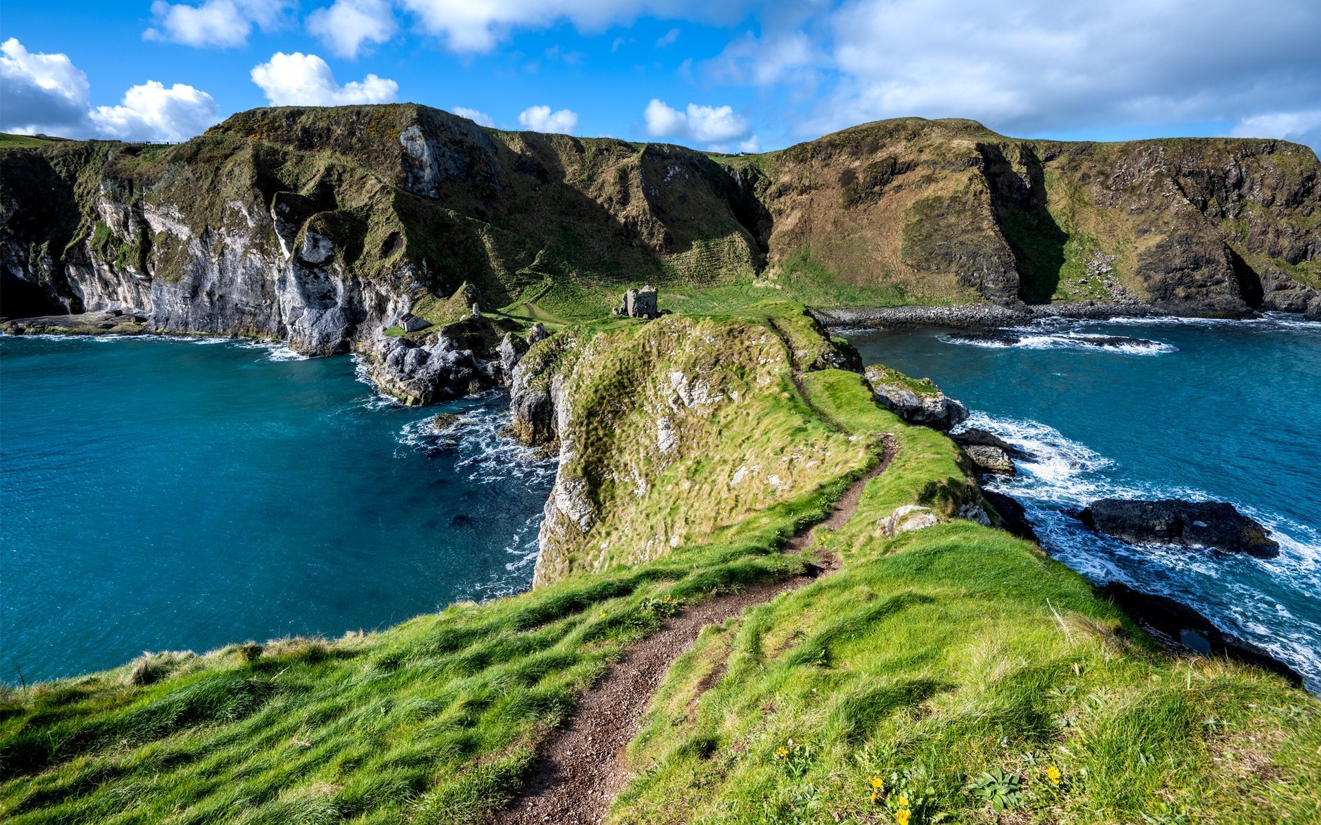 A path going up a cliff to. A castle overlooking a body of water. Kinbane Castle, Brad Burgess Photography, Talking Excitingly