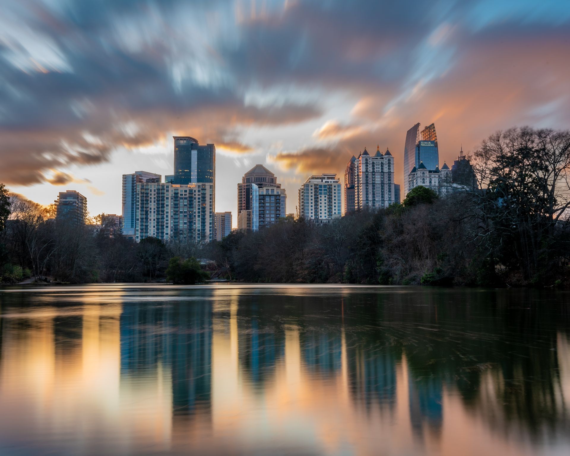 Midown Atlanta skyline is reflected of of Lake Clara Meer at sunset . Brad Burgess Photography, Talking Excitingly