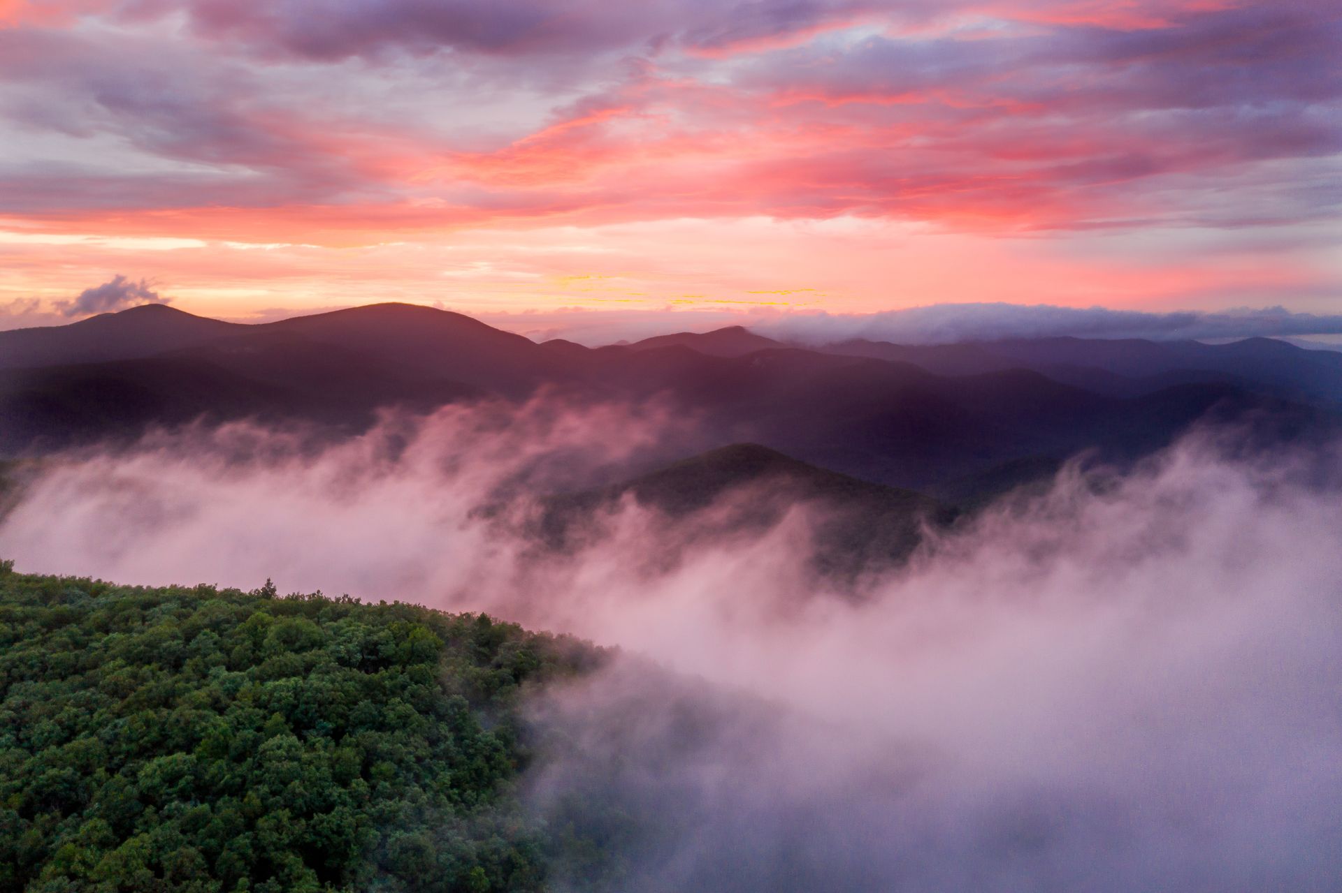 an aerial view of a foggy mountain range at sunset . Appalachian Trail, Preacher's Rock, Talking Excitingly, Brad Burgess Photography