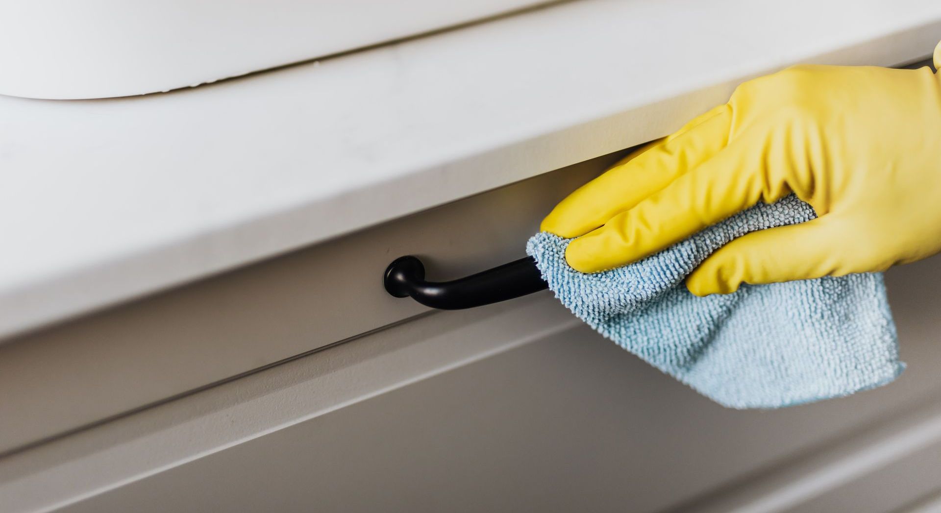 person cleaning a handle