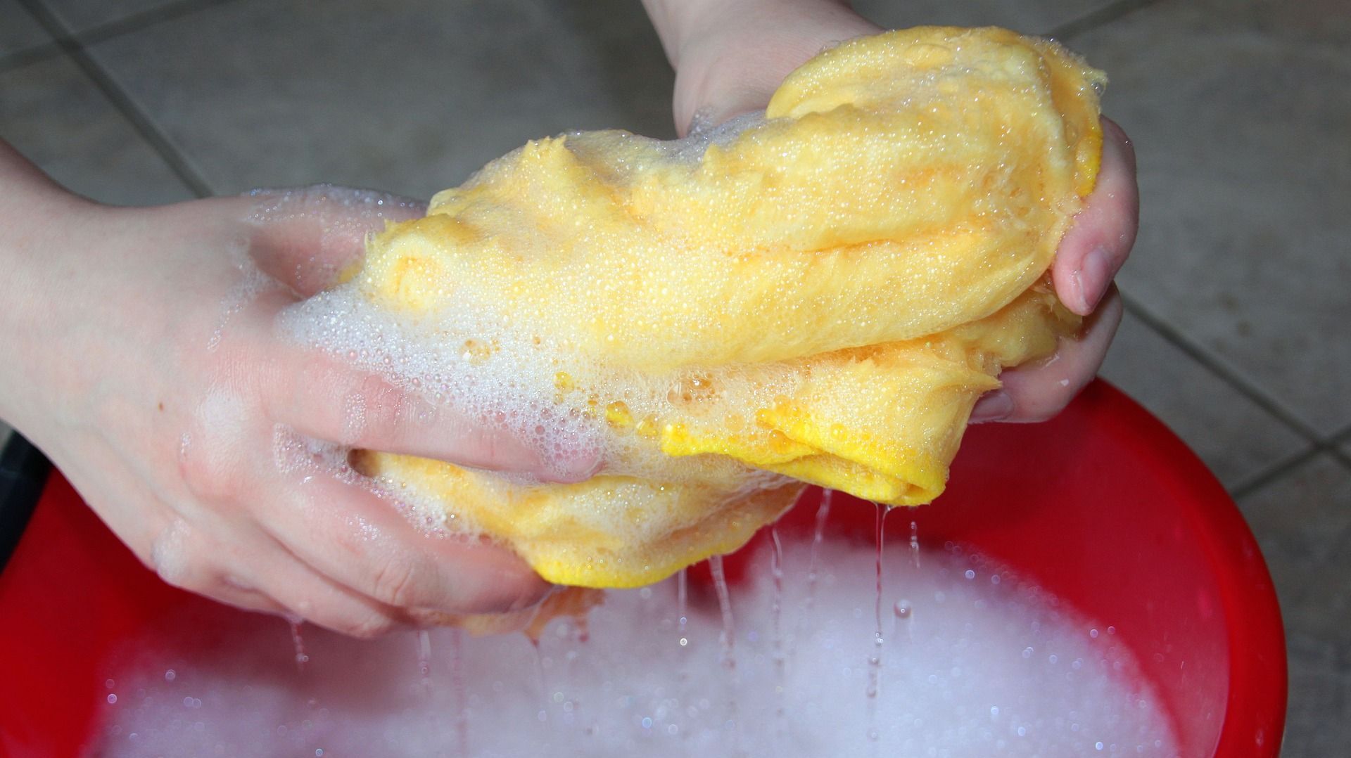 bucket and rag in soapy water