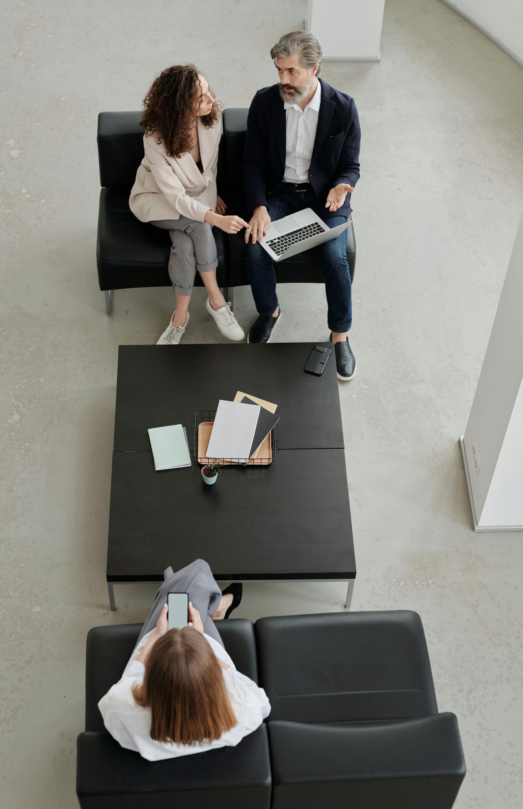 3 people in an office lobby