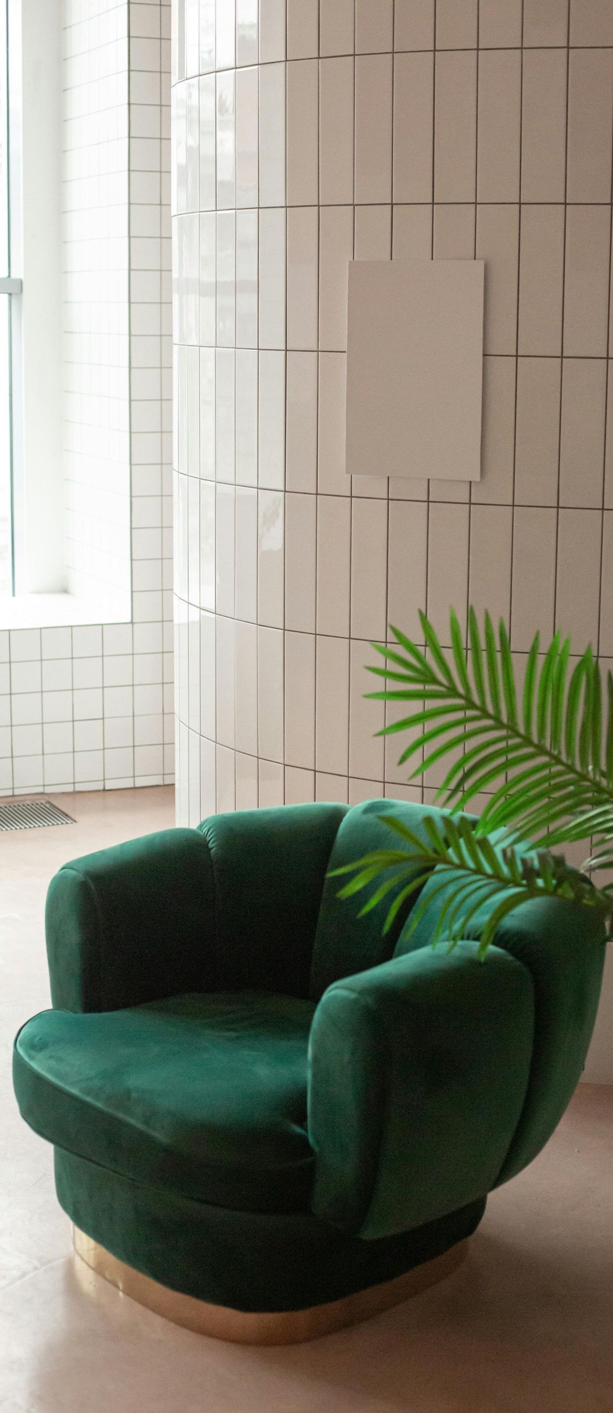green chair in an office lobby
