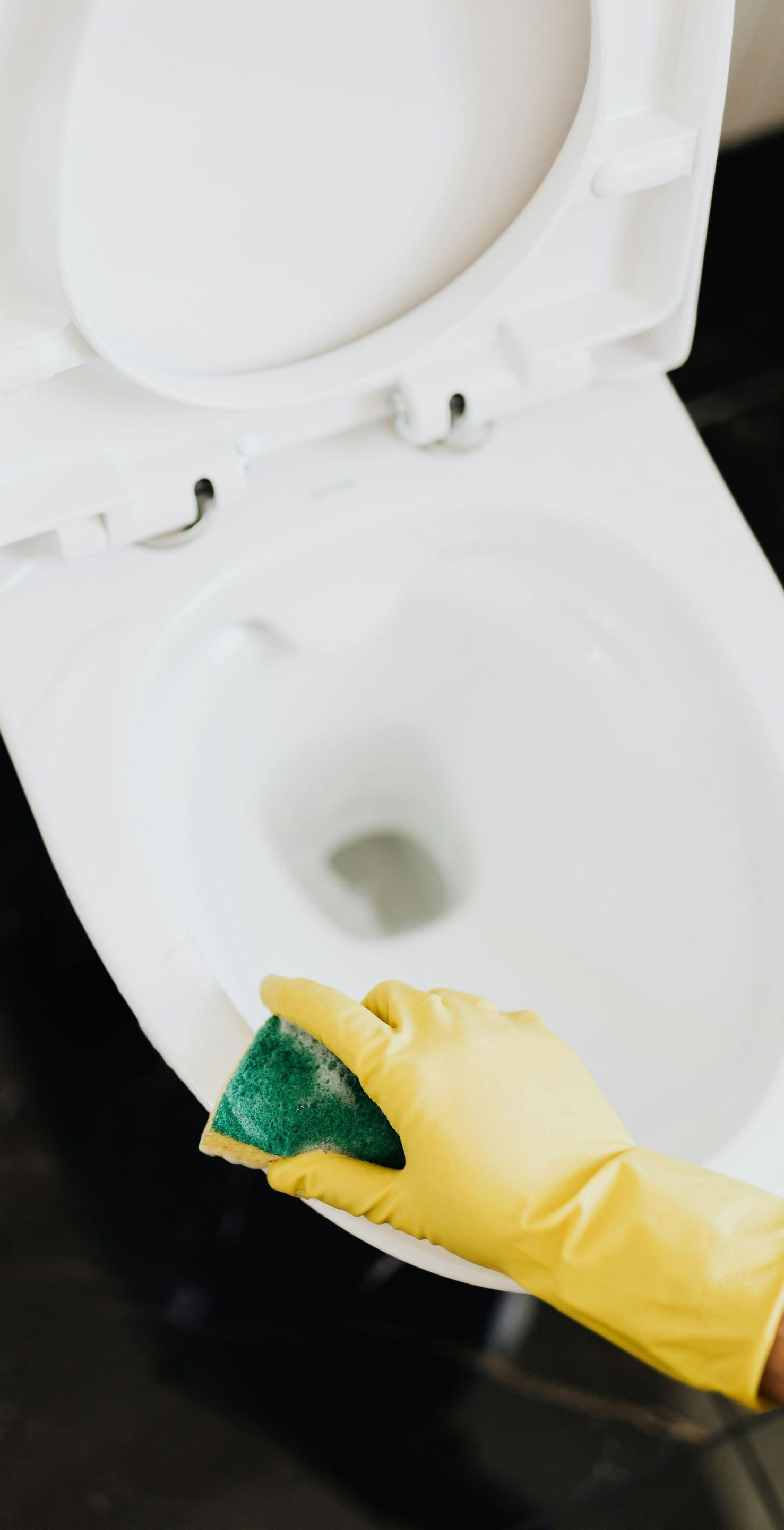 cleaning a toilet