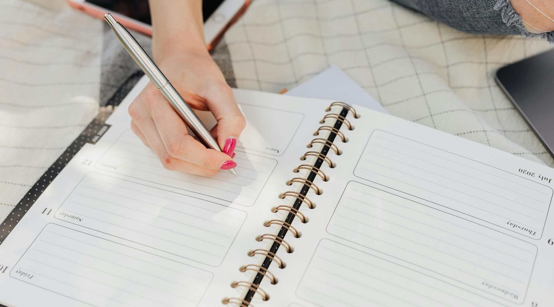 woman filling in a planner