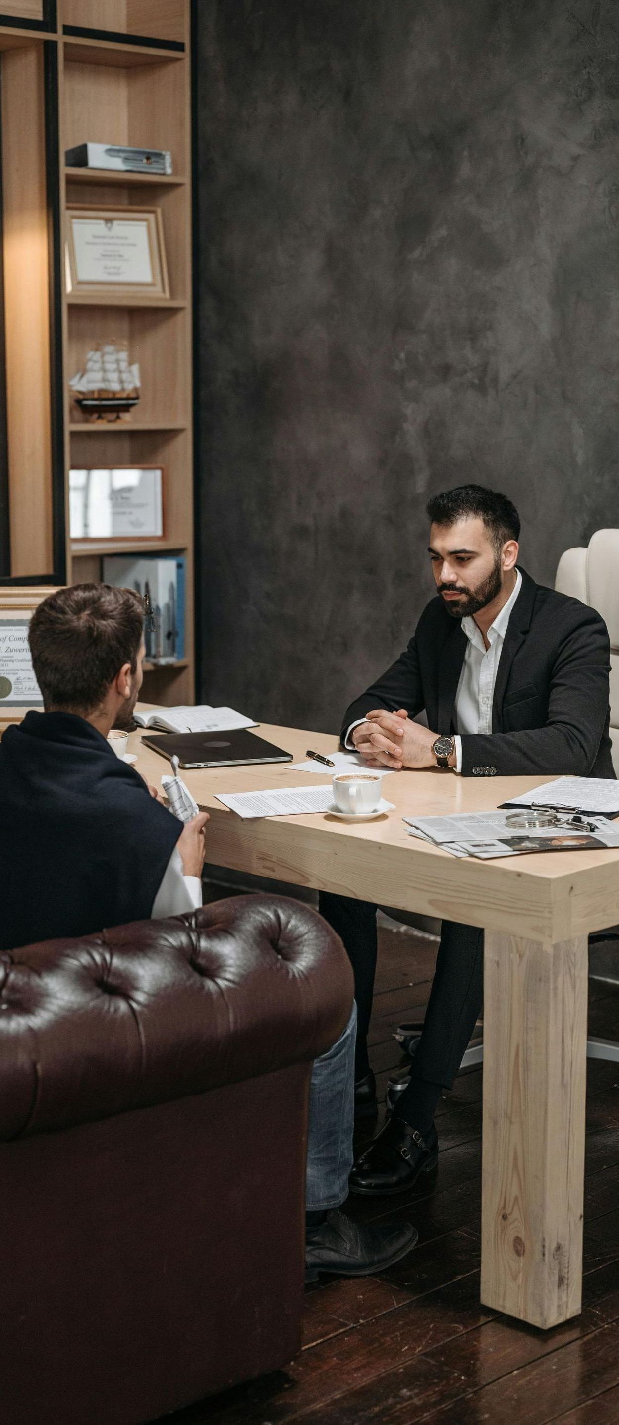 man meeting with another man in an office