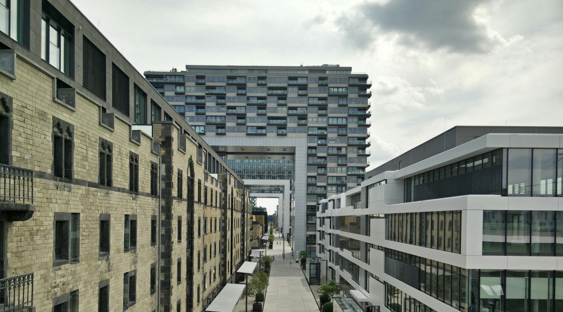 A row of buildings with a large building in the middle