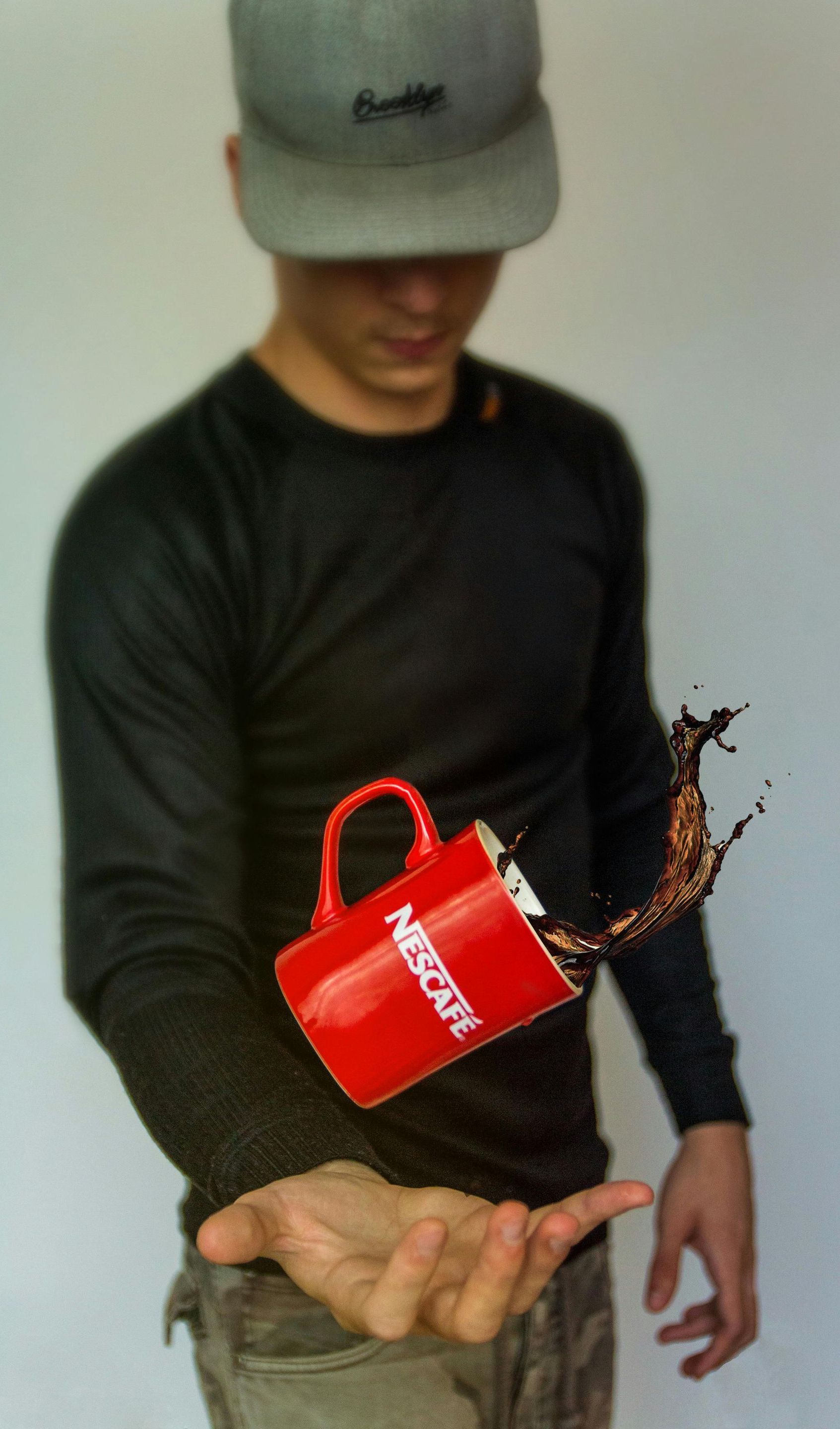 man spilling mug of coffee
