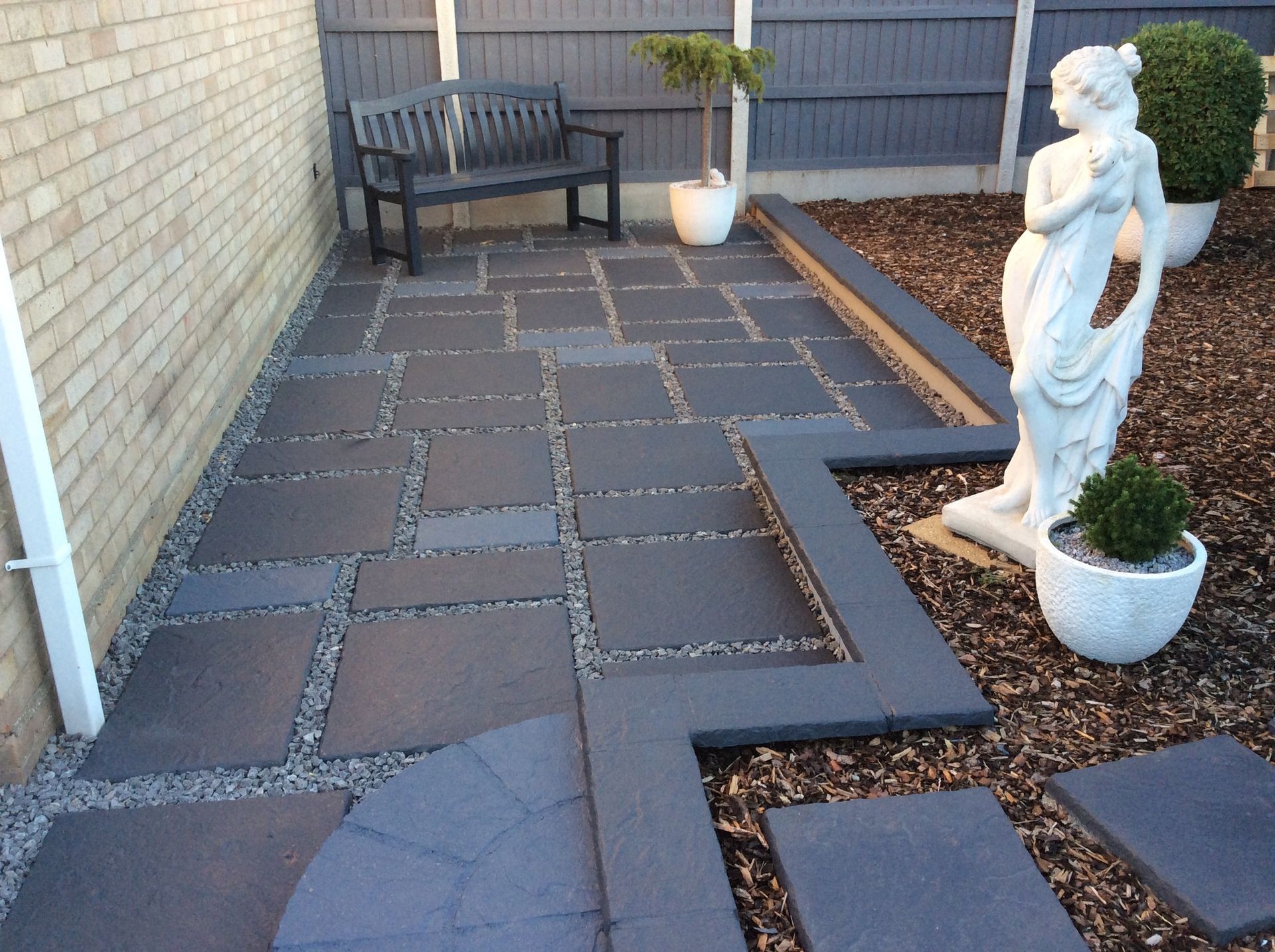 Concrete patio stones that have been painted and sealed by Hedon Exterior Cleaning