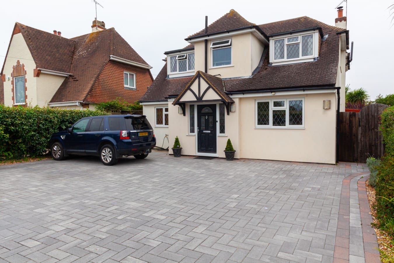 Large driveway cleaning service in Hull. White rendered house in the foreground. 