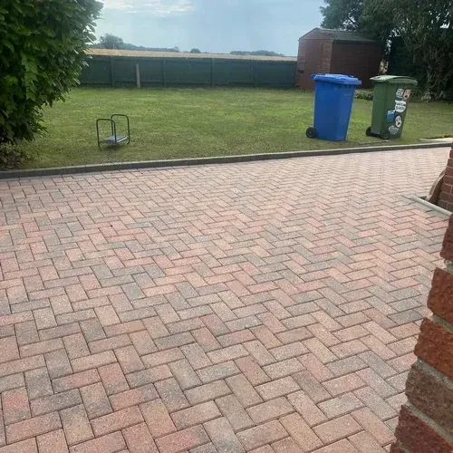Block paved patio after professional cleaning with the original colour restored