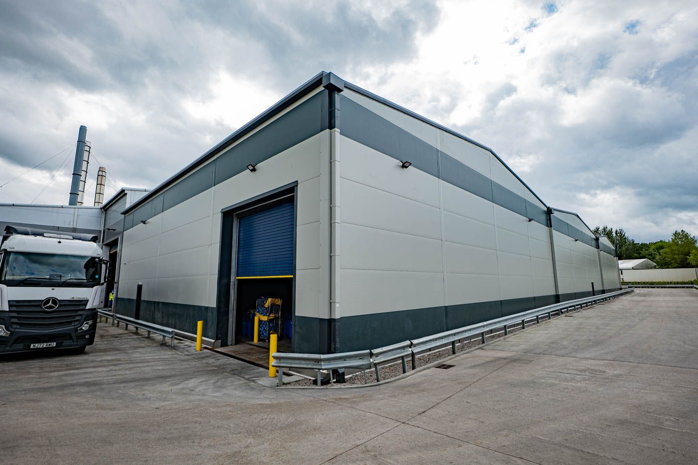 Soft washing cladding on commercial building
