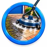 Protective treatment being spray applied to block paving after cleaning and restoration