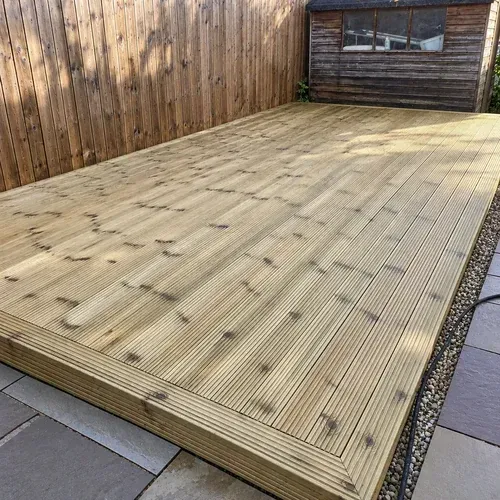 Freshly cleaned timber decking prepared for restoration and refinishing
