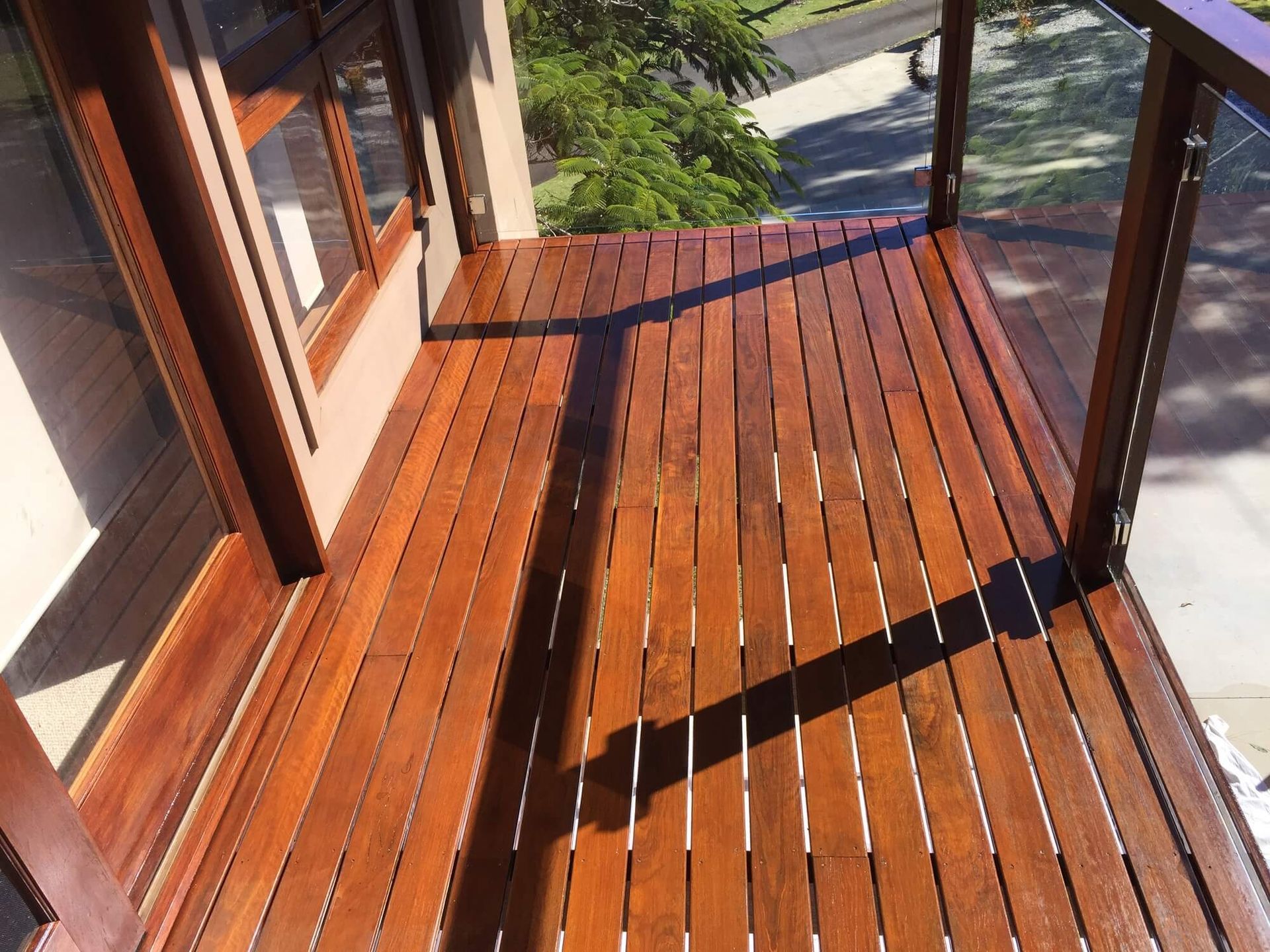 Deck veranda current mid flow a restoration service. Hardwood decking is sanded and ready for refurbishment. 