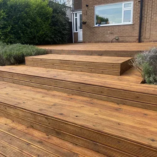 Restored raised timber decking in Anlaby after repairs and Amber Light Oak decking oil