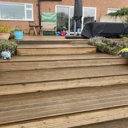 Raised timber decking in Anlaby before cleaning, repairs and restoration