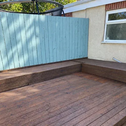 Restored timber decking in Beverley finished with Rosewood decking oil and Sage Green fencing