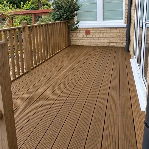 Softwood decking that has been refinished in a natural oak decking oil for a regular customer in Hessle