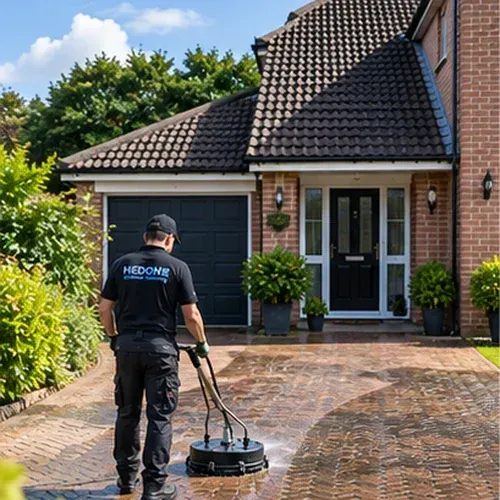 Professional pressure washing of a block paved driveway