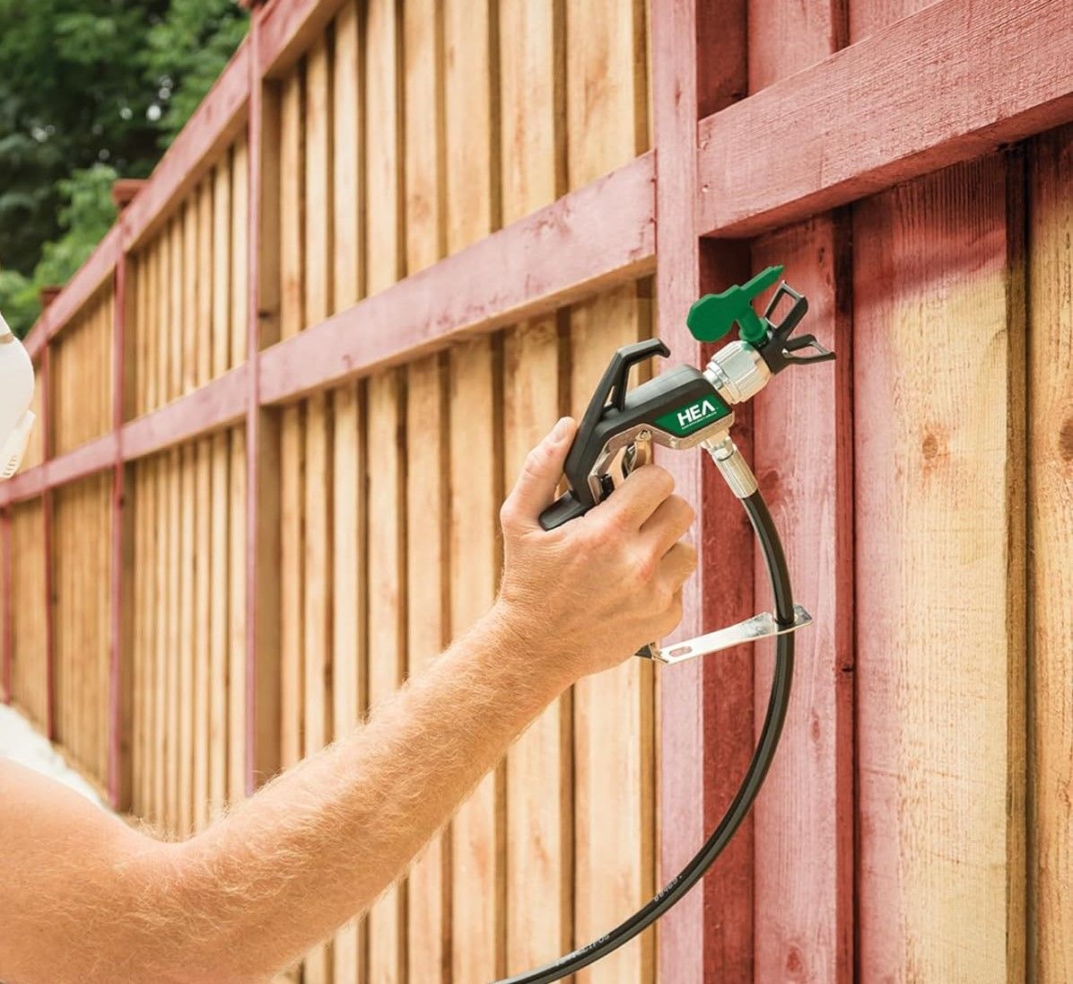 large fence professionally cleaned and painted by Hedon Exterior Cleaning through airless sprayer.