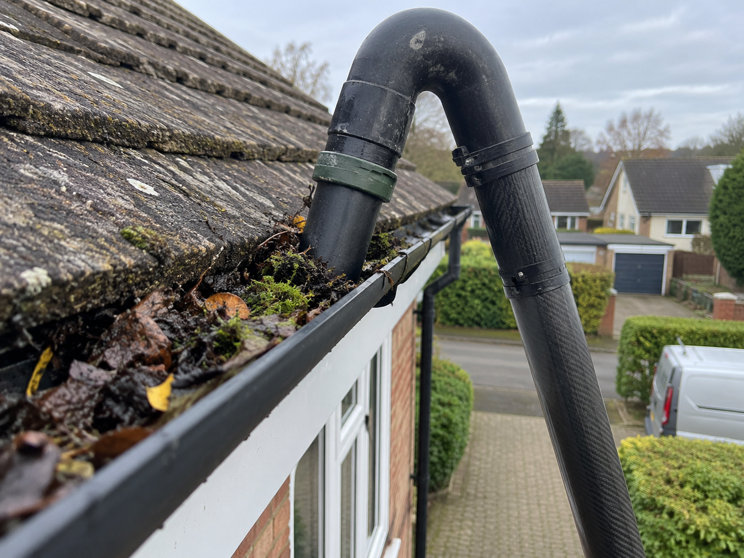 Gutter cleaning using a professional gutter vacuum on a UK home in Hull and East Yorkshire
