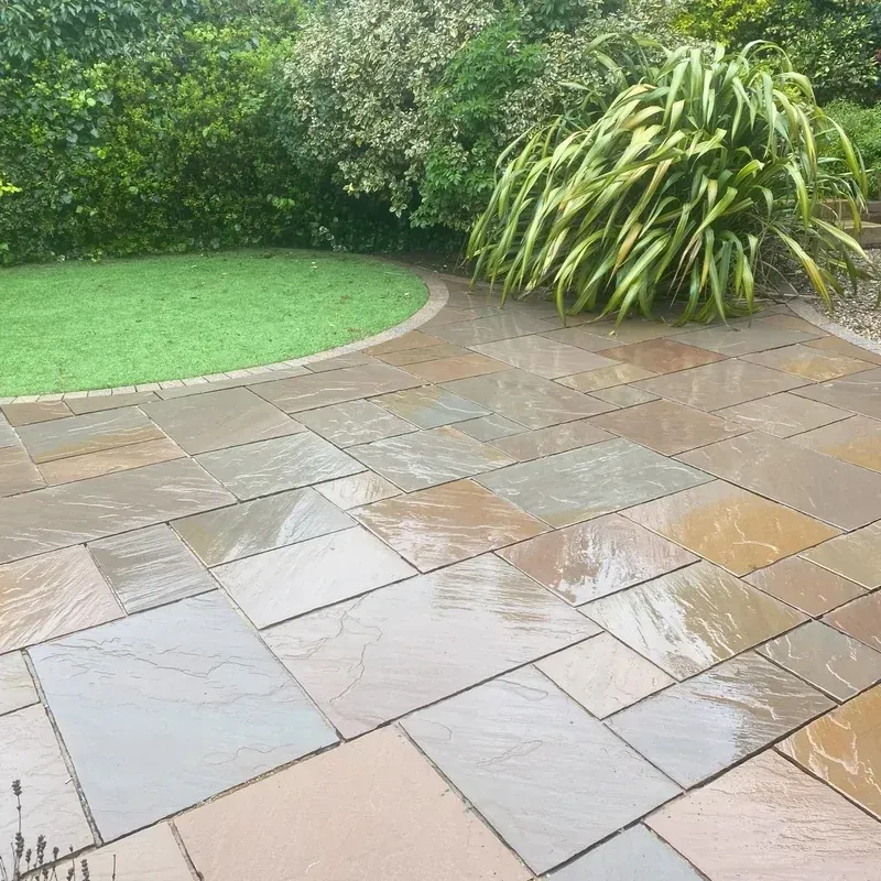Clean Indian sandstone patio after professional patio cleaning