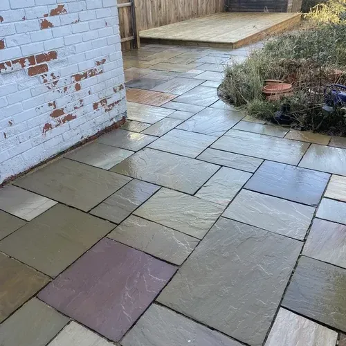 Indian sandstone patio after professional cleaning revealing the natural stone colours