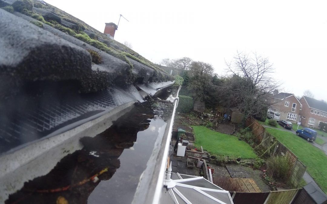 Overflowing gutters cleaned and ready for work.