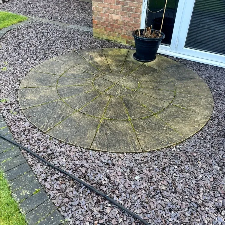 Exterior paving before pressure washing and blackspot treatment.