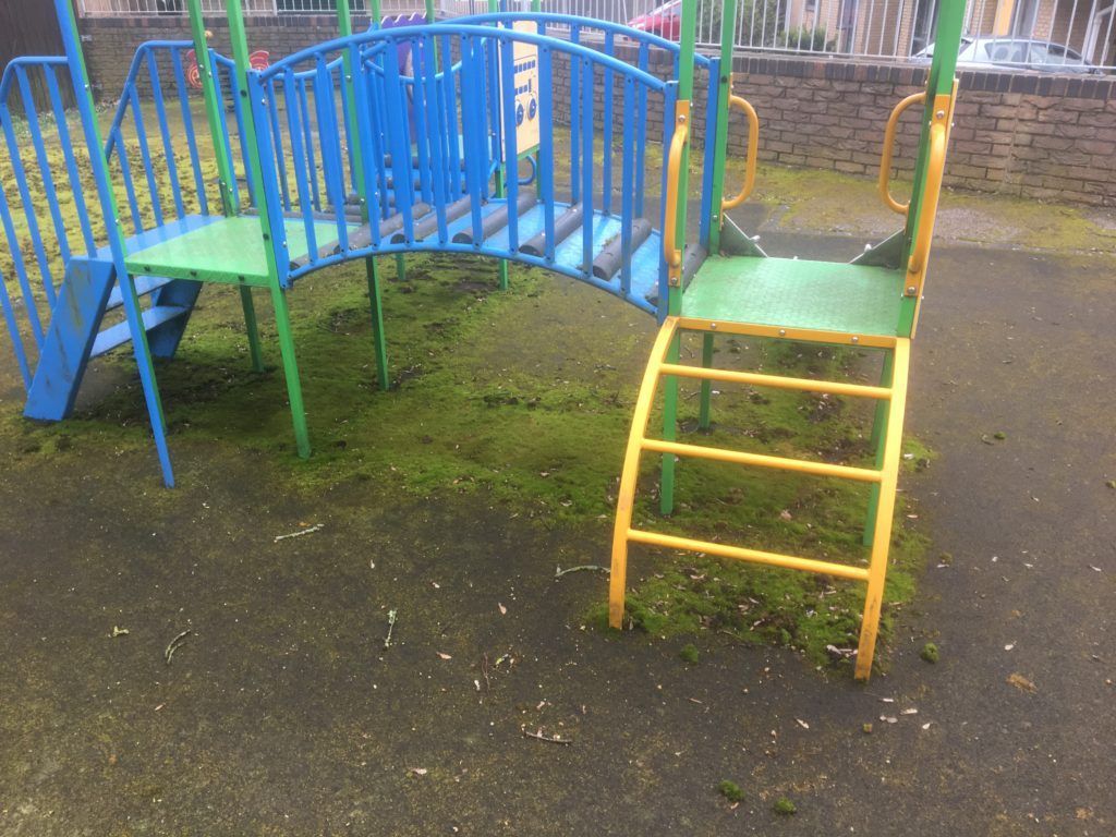 Playground dirty and covered with moss
