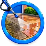 Protective treatment being spray applied to block paving after cleaning and restoration