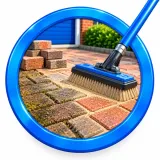 Block paving restoration with fresh jointing sand brushed into cleaned paving