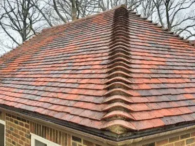 Concrete tiled roof following professional moss removal, showing the cleaned roof tiles.