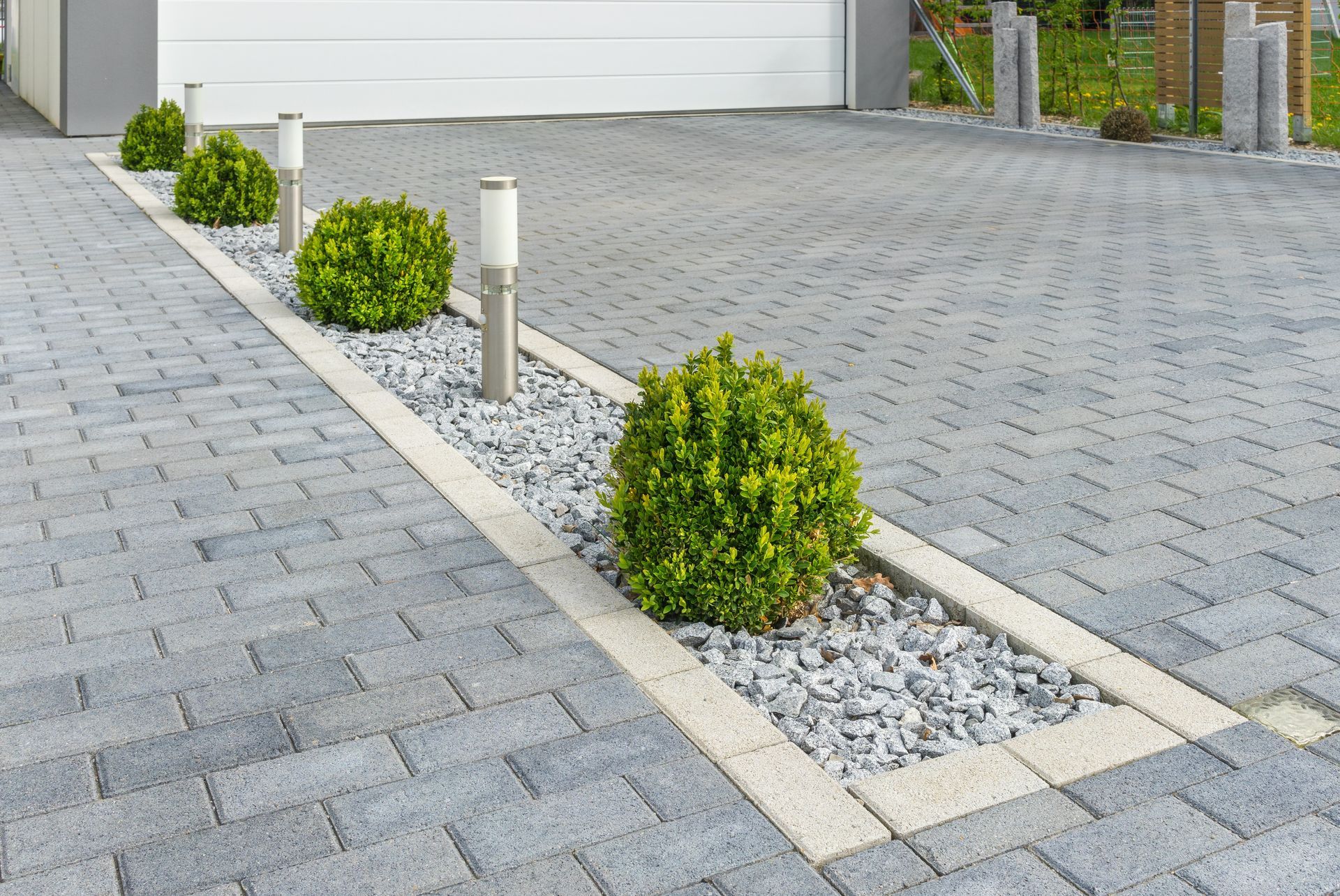 Block paving sealer: Expert application of protective sealant on paved surfaces, enhancing color vibrancy and safeguarding against weathering for long-term durability