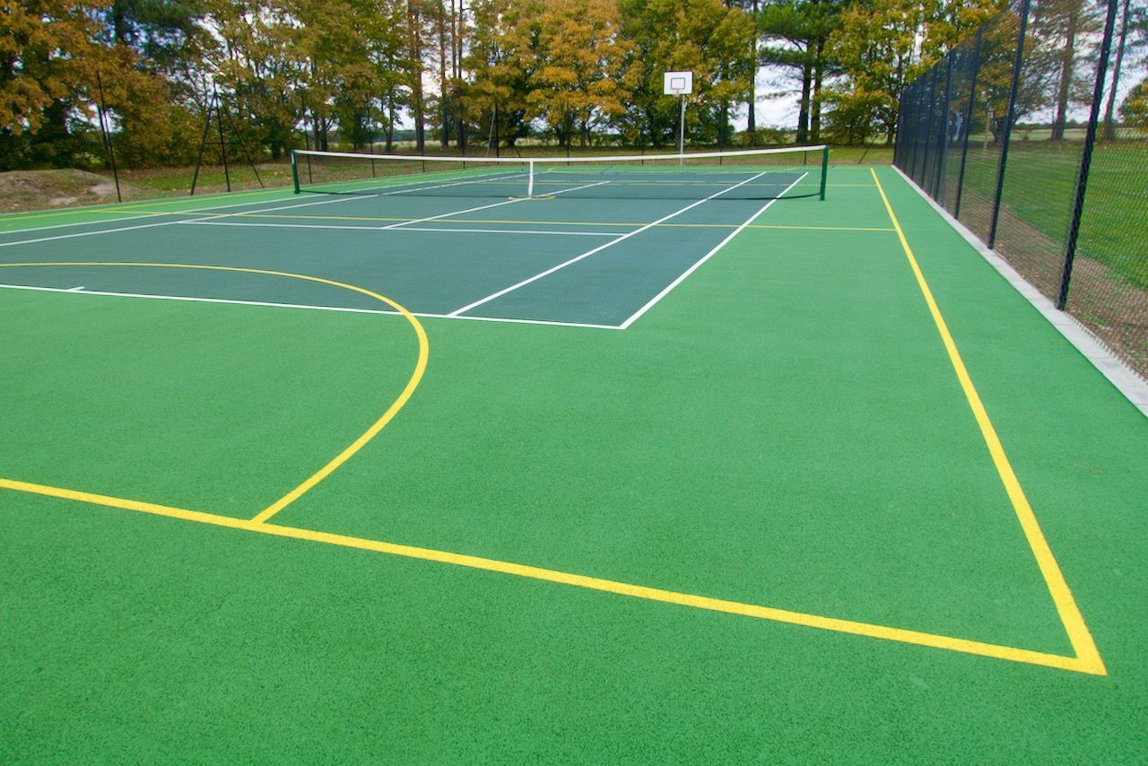 Soft washing tennis courts to prevent contamination.