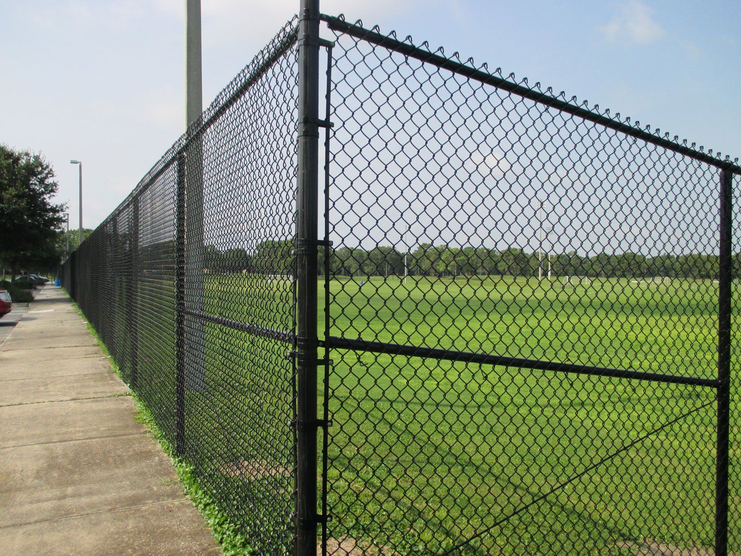 Black Vinyl Fence Braced & Trussed At Corners — Jacksonville, FL — Newsom Fence
