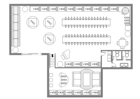 Floor plan of a commercial space with a large central seating area, peripheral displays, a separate lounge, and restrooms.
